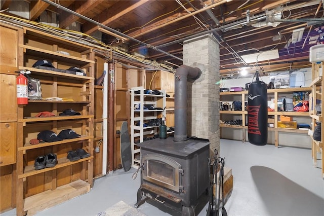 80 Flagg Ave, Warwick, RI 02886 - unfinished below grade area with a wood stove