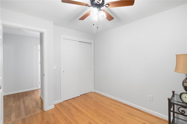 80 Flagg Ave, Warwick, RI 02886 - unfurnished bedroom featuring light wood-type flooring, a closet, baseboards, and a ceiling fan