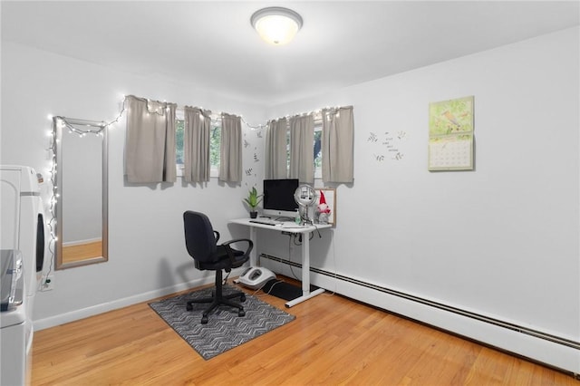 80 Flagg Ave, Warwick, RI 02886 - office space featuring a baseboard radiator, estacked washer and dryer, and wood finished floors