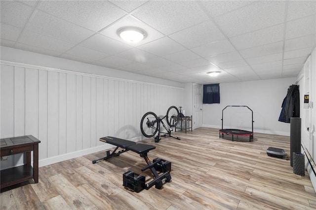 80 Flagg Ave, Warwick, RI 02886 - workout area featuring light wood-style flooring, a drop ceiling, and baseboards