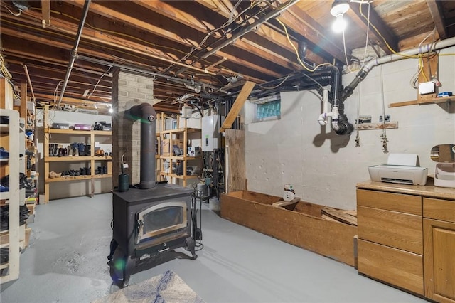 80 Flagg Ave, Warwick, RI 02886 - unfinished basement featuring a wood stove