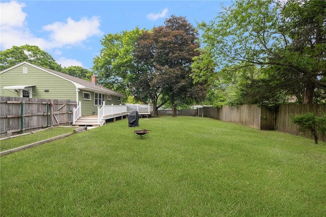 80 Flagg Ave, Warwick, RI 02886 - view of yard with a wooden deck and an outdoor fire pit