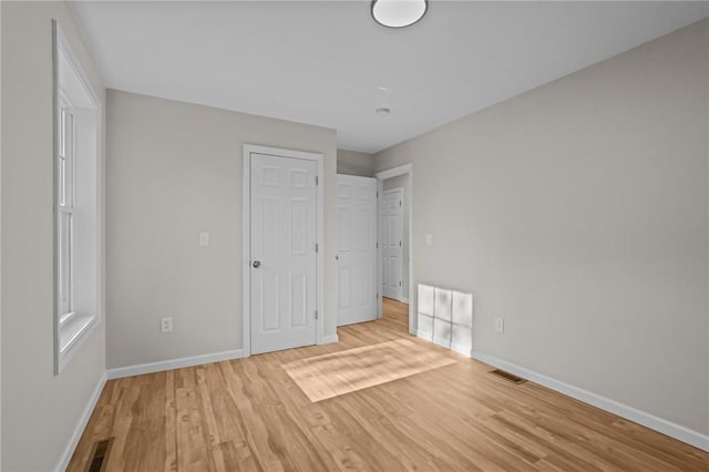 17 Judith St, Providence, RI 02909 - unfurnished bedroom with baseboards and wood finished floors