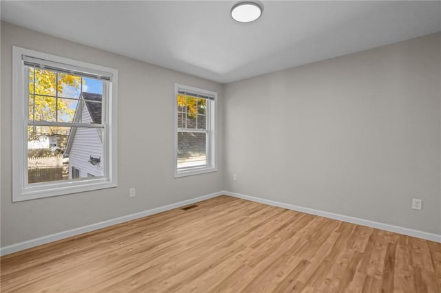 17 Judith St, Providence, RI 02909 - unfurnished room featuring light wood-style flooring, plenty of natural light, and baseboards