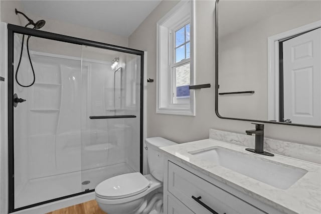 17 Judith St, Providence, RI 02909 - bathroom featuring a stall shower, toilet, vanity, and wood finished floors