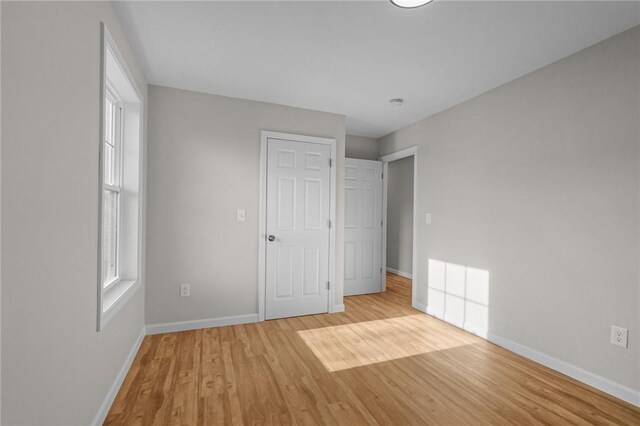 17 Judith St, Providence, RI 02909 - unfurnished bedroom with baseboards and wood finished floors