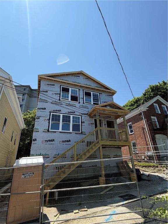 17 Judith St, Providence, RI 02909 - view of front of property featuring a fenced front yard, a gate, and stairway