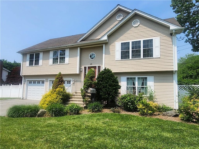 49 Wine St, Cranston, RI 02920 - bi-level home with an attached garage and concrete driveway