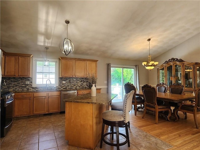 49 Wine St, Cranston, RI 02920 - kitchen with a chandelier, appliances with stainless steel finishes, a sink, and healthy amount of natural light