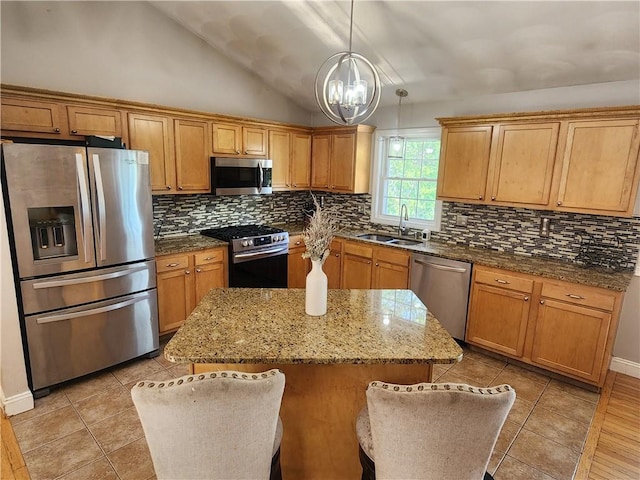 49 Wine St, Cranston, RI 02920 - kitchen featuring stainless steel appliances, a sink, tasteful backsplash, lofted ceiling, and a chandelier