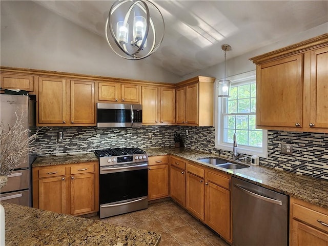 49 Wine St, Cranston, RI 02920 - kitchen featuring stainless steel appliances, vaulted ceiling, a sink, a chandelier, and tasteful backsplash