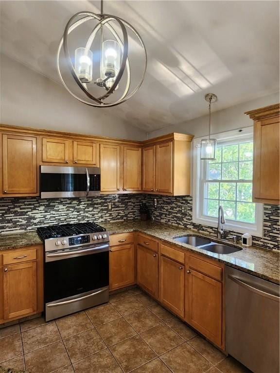49 Wine St, Cranston, RI 02920 - kitchen with appliances with stainless steel finishes, a sink, vaulted ceiling, tasteful backsplash, and a chandelier