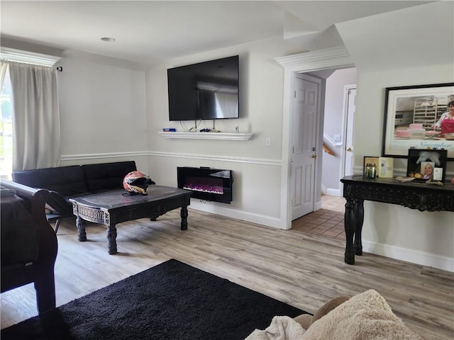 49 Wine St, Cranston, RI 02920 - living area featuring wood finished floors, a glass covered fireplace, and baseboards