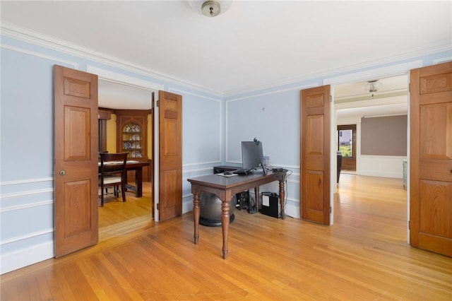 2 Carvin Ct, Warwick, RI 02886 - office area featuring light wood-type flooring, a decorative wall, ornamental molding, and a wainscoted wall