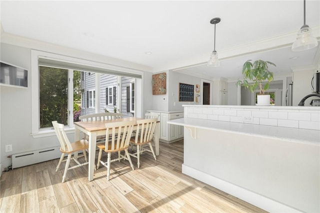 2 Carvin Ct, Warwick, RI 02886 - dining area featuring ornamental molding, light wood finished floors, and baseboard heating