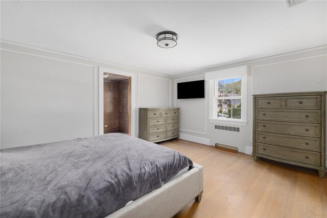 2 Carvin Ct, Warwick, RI 02886 - bedroom with radiator heating unit, light wood finished floors, and ornamental molding