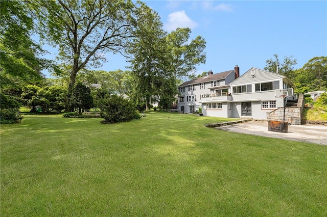 2 Carvin Ct, Warwick, RI 02886 - view of grassy yard featuring stairs and a patio area