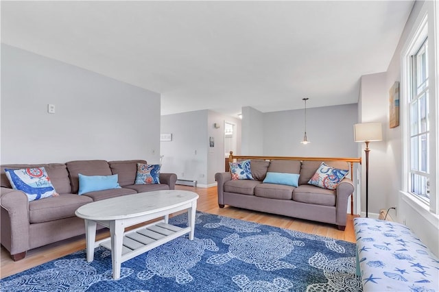 37 Seabreeze Ter, South Kingstown, RI 02879 - living area with wood finished floors, a baseboard radiator, and baseboards