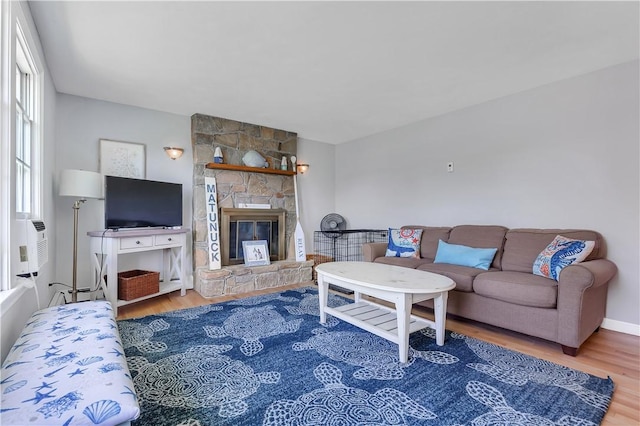 37 Seabreeze Ter, South Kingstown, RI 02879 - living room with wood finished floors and a stone fireplace