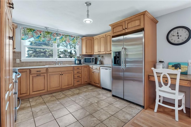 37 Seabreeze Ter, South Kingstown, RI 02879 - kitchen featuring appliances with stainless steel finishes, a sink, tasteful backsplash, and light countertops