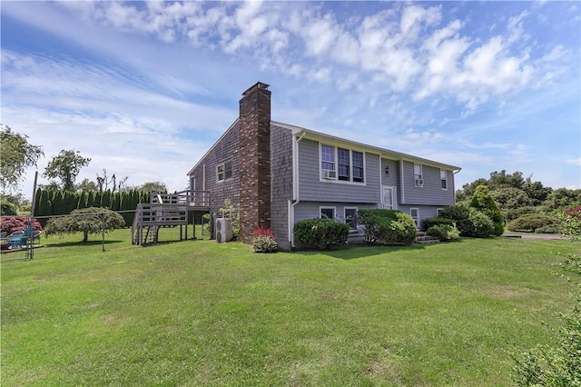 37 Seabreeze Ter, South Kingstown, RI 02879 - view of property exterior with a chimney, a lawn, and a deck