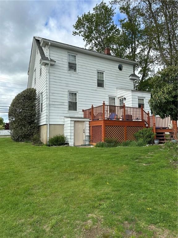 53 Wampanoag Trl, East Providence, RI 02915 - rear view of property with a wooden deck and a yard