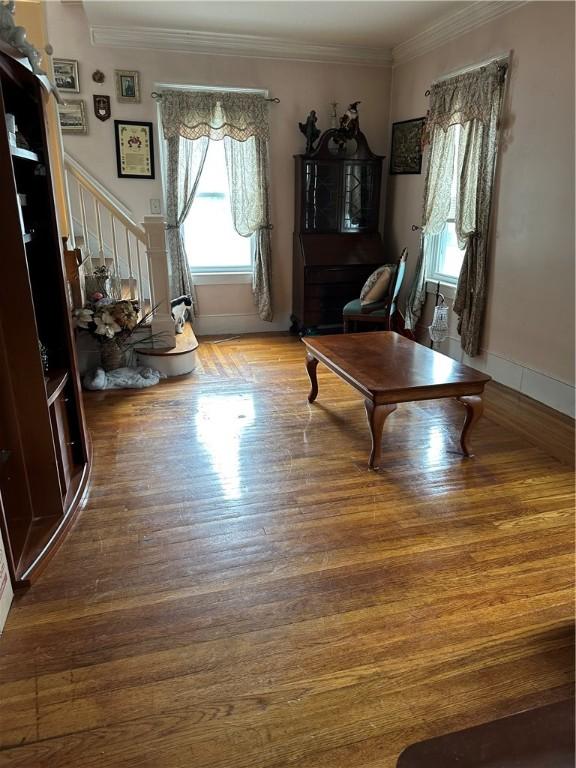 53 Wampanoag Trl, East Providence, RI 02915 - living room with wood finished floors, ornamental molding, and stairs