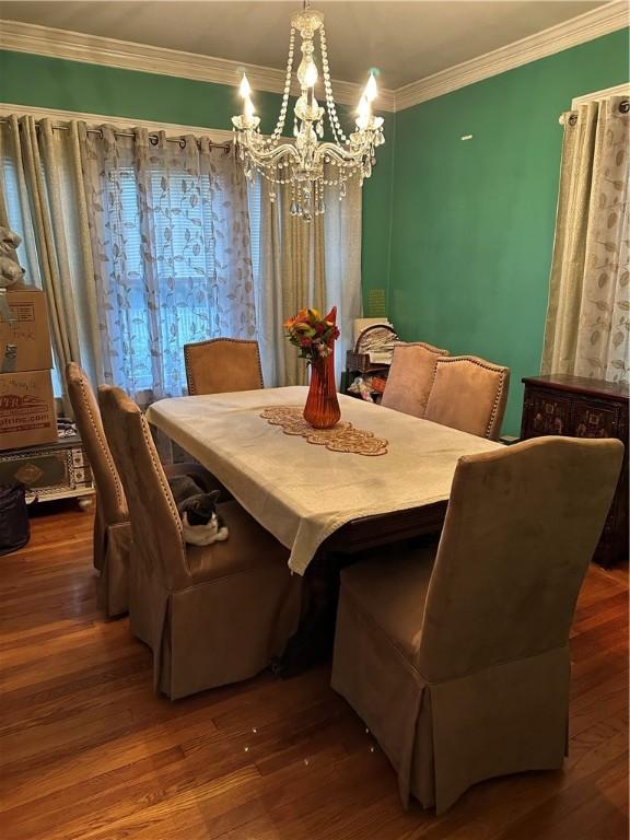 53 Wampanoag Trl, East Providence, RI 02915 - dining room with a chandelier, crown molding, and wood finished floors