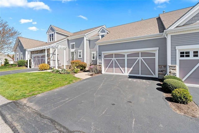 156 Hampton Way S, Kingstown, RI 02879 - multi unit property featuring a front yard, a pergola, driveway, stone siding, and a garage