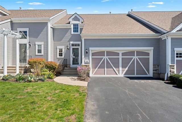 156 Hampton Way S, Kingstown, RI 02879 - multi unit property with asphalt driveway, a garage, a front yard, and a shingled roof