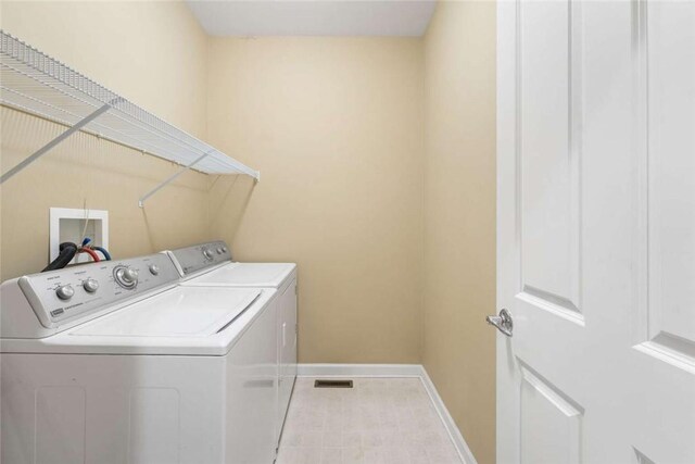 156 Hampton Way S, Kingstown, RI 02879 - washroom with washing machine and clothes dryer and baseboards