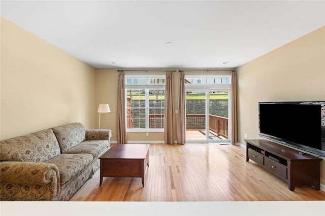 156 Hampton Way S, Kingstown, RI 02879 - living area featuring wood finished floors, plenty of natural light, and baseboards
