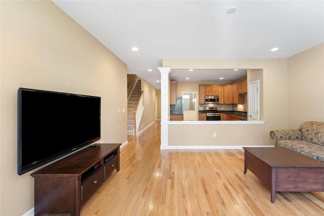 156 Hampton Way S, Kingstown, RI 02879 - living area with stairway, light wood-style floors, ornate columns, recessed lighting, and baseboards