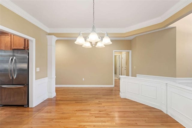156 Hampton Way S, Kingstown, RI 02879 - unfurnished dining area with a chandelier, crown molding, light wood-type flooring, and a wainscoted wall