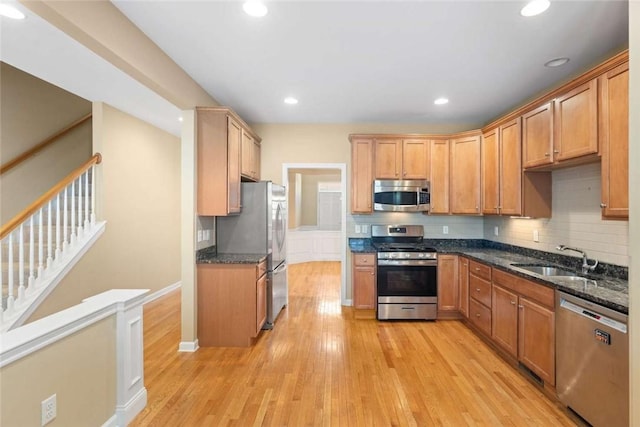 156 Hampton Way S, Kingstown, RI 02879 - kitchen with appliances with stainless steel finishes, light wood finished floors, dark stone countertops, decorative backsplash, and recessed lighting