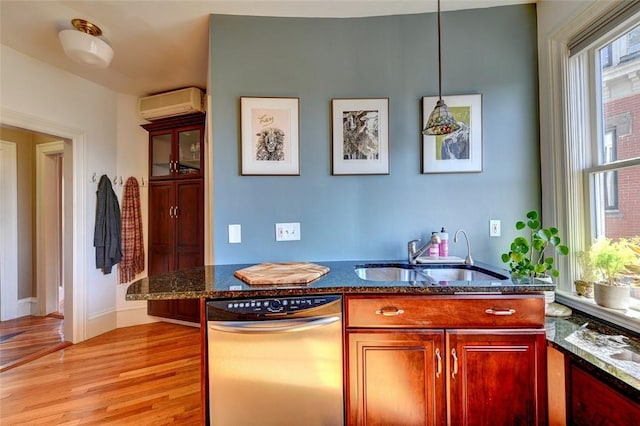 384 Benefit St Unit 2, Providence, RI 02903 - bar area featuring dishwasher, a wall mounted AC, a sink, light wood-type flooring, and pendant lighting