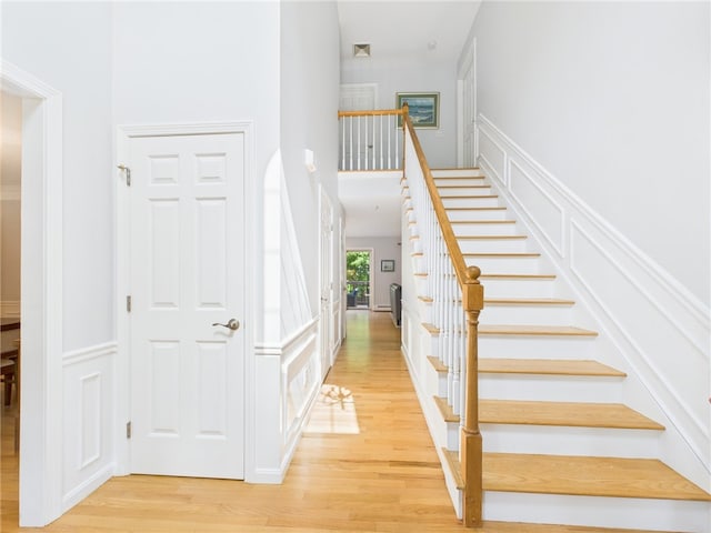 64 E Park Ln, South Kingstown, RI 02879 - stairway with wood finished floors and a towering ceiling