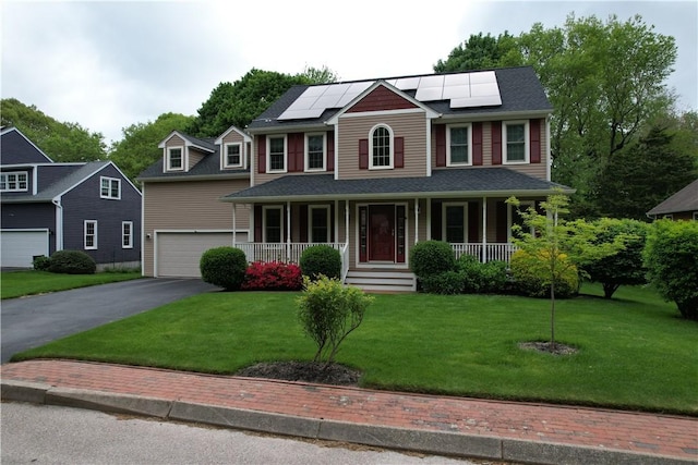 64 E Park Ln, South Kingstown, RI 02879 - colonial home with covered porch, asphalt driveway, an attached garage, roof mounted solar panels, and a front yard