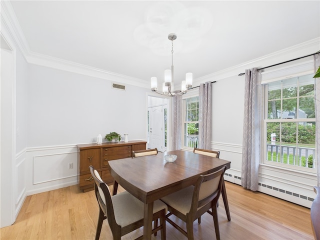 64 E Park Ln, South Kingstown, RI 02879 - dining space featuring a chandelier, plenty of natural light, crown molding, light wood-style floors, and baseboard heating