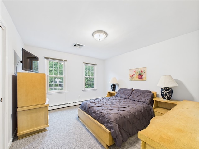 64 E Park Ln, South Kingstown, RI 02879 - carpeted bedroom featuring a baseboard heating unit