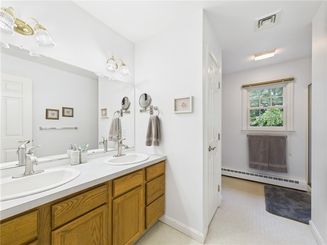 64 E Park Ln, South Kingstown, RI 02879 - bathroom featuring a baseboard radiator and double vanity