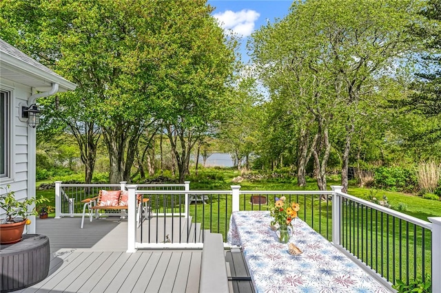22 Pond View Dr, Little Compton, RI 02837 - wooden terrace featuring a yard, outdoor dining area, and view of wooded area