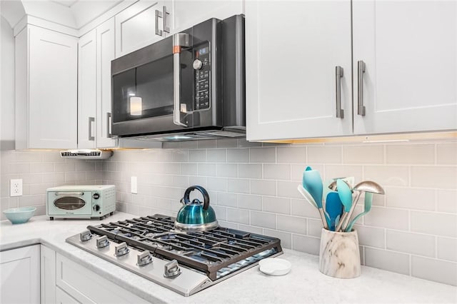 22 Pond View Dr, Little Compton, RI 02837 - kitchen featuring stainless steel appliances, white cabinetry, and light countertops