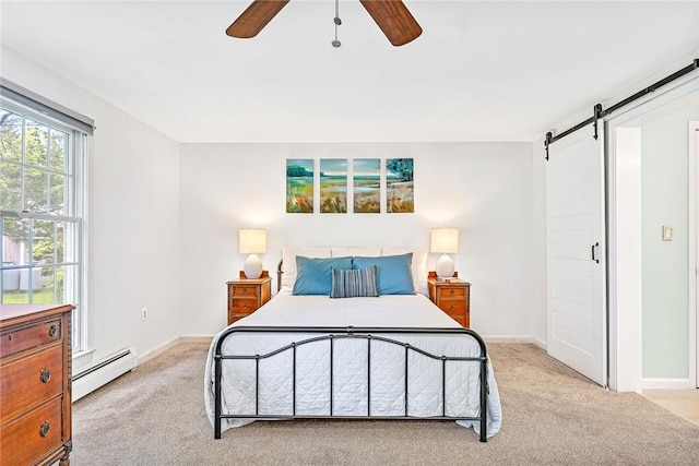 22 Pond View Dr, Little Compton, RI 02837 - bedroom featuring a baseboard heating unit, a barn door, light colored carpet, and baseboards