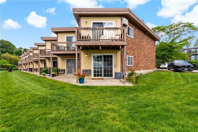 3940 Post Rd Unit 38, Warwick, RI 02886 - rear view of property featuring a lawn, a patio, central AC, and a balcony