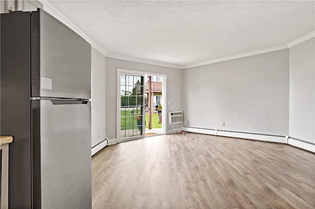 3940 Post Rd Unit 38, Warwick, RI 02886 - unfurnished living room featuring wood finished floors, crown molding, baseboard heating, an AC wall unit, and baseboards