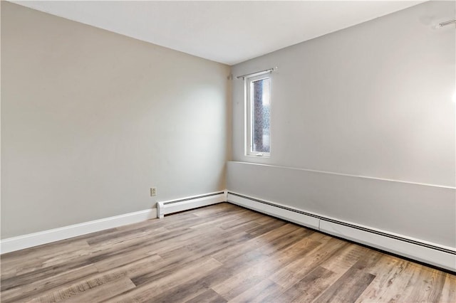 3940 Post Rd Unit 38, Warwick, RI 02886 - unfurnished room featuring wood finished floors, a baseboard radiator, and baseboards