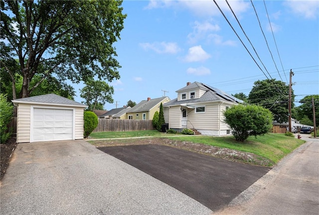 66 Dean Ave, Smithfield, RI 02917 - view of side of home featuring asphalt driveway, a garage, and an outbuilding
