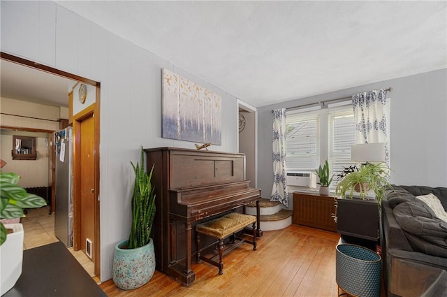 66 Dean Ave, Smithfield, RI 02917 - sitting room with light wood finished floors and cooling unit