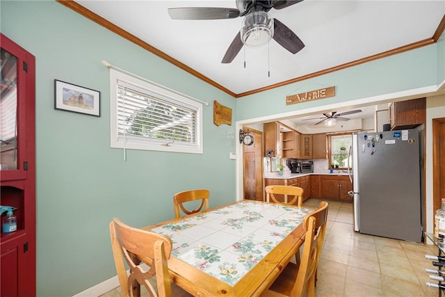 66 Dean Ave, Smithfield, RI 02917 - dining room featuring a ceiling fan, crown molding, and light tile patterned floors